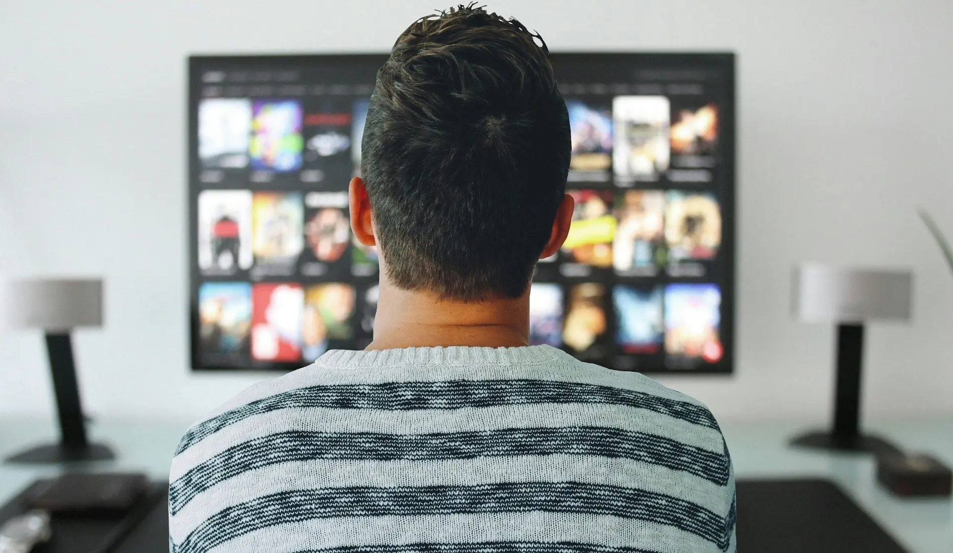 Man trying to decide what NFT-backed series he wants to watch.