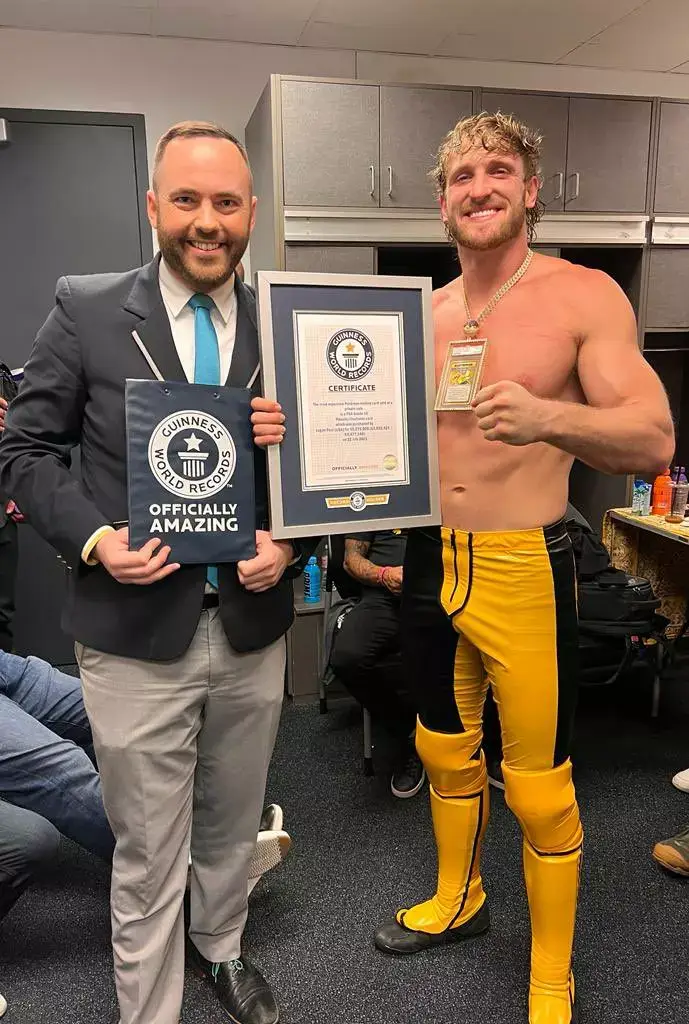 Logan Paul holding Guinness World Record for Pikachu Illustrator Pokemon card