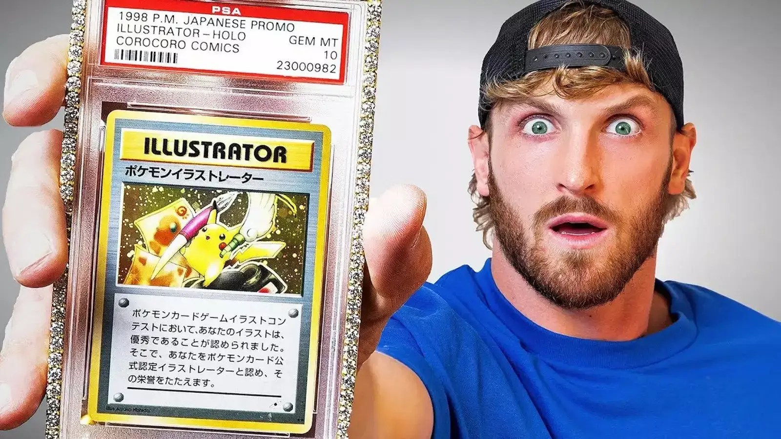 Logan Paul holding a rare Pokemon trading card